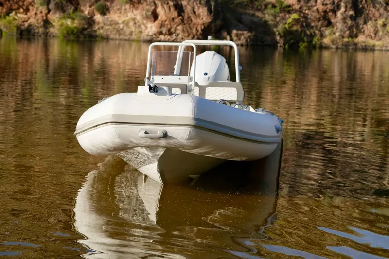 Slide: The Image of 2027 Tide Craft Kodiak 16 boat on calm water, reflecting natural surroundings. - 8
