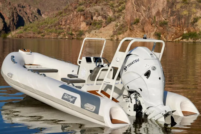 Slide: The Image of Tide Craft Kodiak 16 boat on calm water, featuring Tohatsu outboard motor, 2027 model. - 5