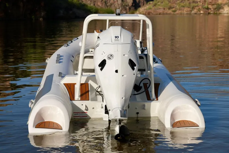 Slide: The Image of 2027 Tide Craft Kodiak 16 boat with outboard motor on calm water. - 4