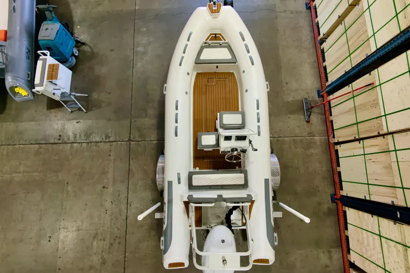 Slide: The Image of Overhead view of 2027 Tide Craft Kodiak 16 boat in warehouse setting. - 12