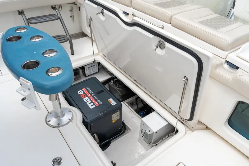 Slide: The Image of 2023 Solace 41CS boat with open hatch revealing Mase generator and seating area. - 34