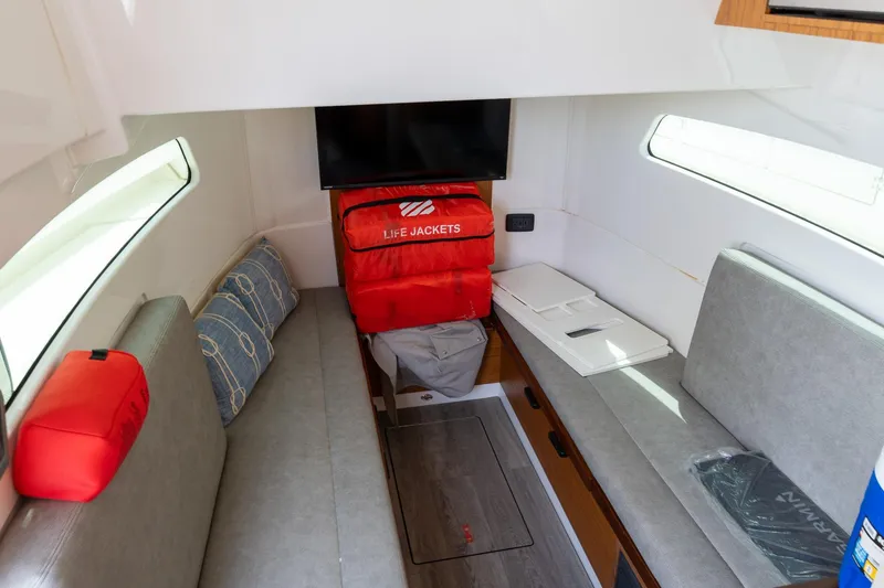 Slide: The Image of Interior of 2023 Solace 41CS boat with seating, life jackets, and storage. - 69