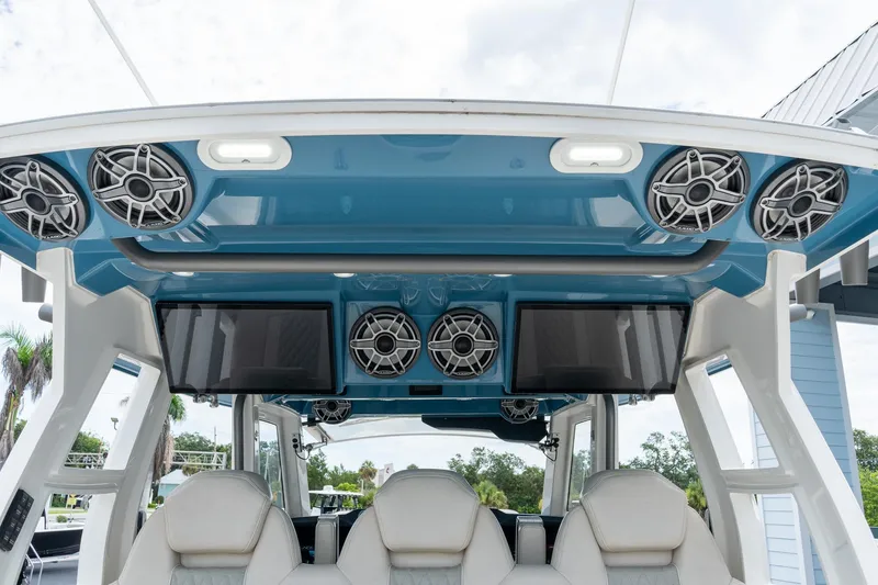 Slide: The Image of 2023 Solace 41CS boat interior with speakers and screens, showcasing luxury and technology. - 36