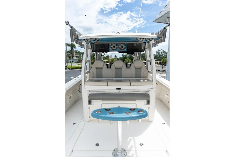 Slide: The Image of 2023 Solace 41CS boat interior with seating and fishing rod holders. - 25