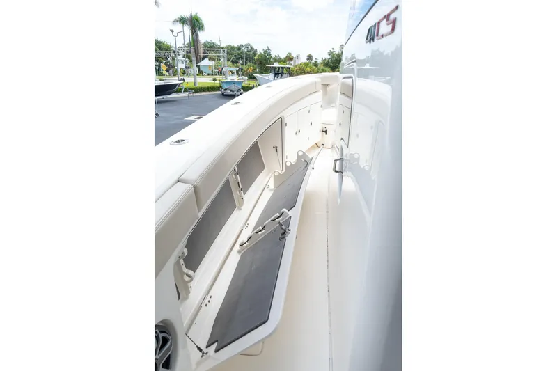 Slide: The Image of 2023 Solace 41CS boat interior with open storage compartments and sleek design. - 54