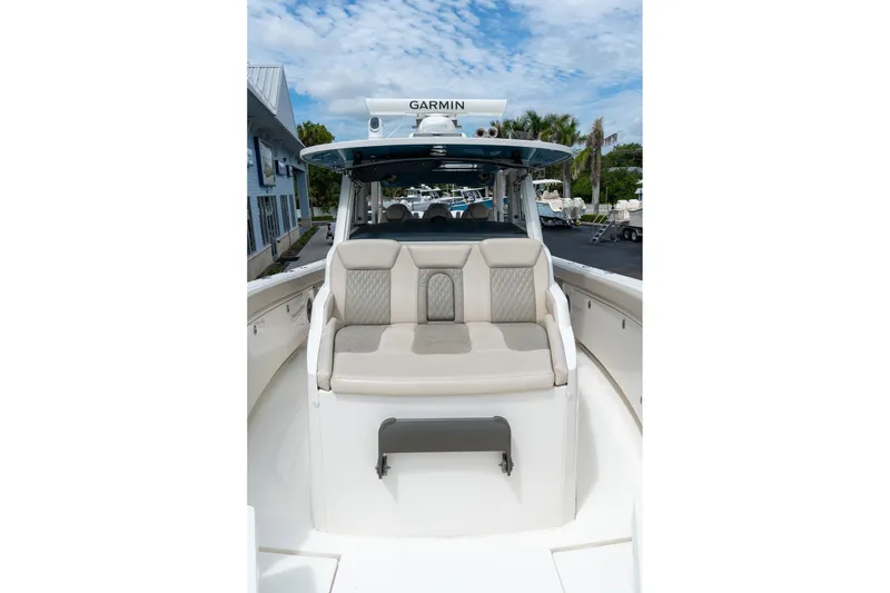 Slide: The Image of 2023 Solace 41CS boat with beige seating, Garmin equipment, and sleek design. - 63