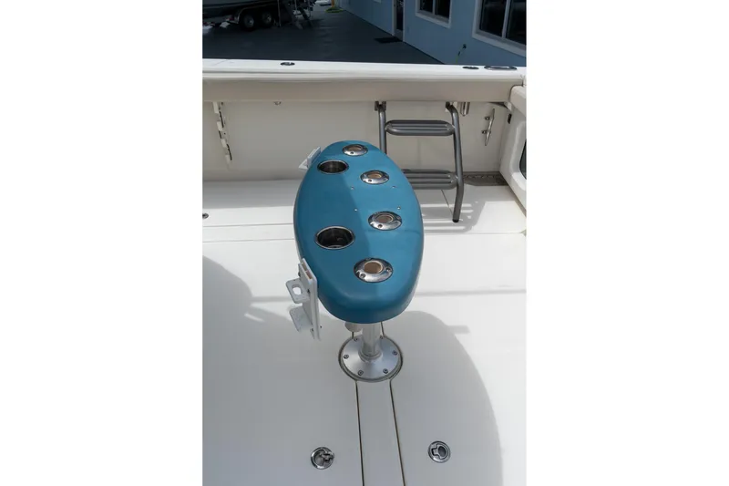 Slide: The Image of 2023 Solace 41CS boat with blue fishing rod holder on deck. - 16