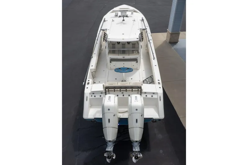 Slide: The Image of 2023 Solace 41CS boat with dual engines, viewed from above, showcasing spacious deck layout. - 2