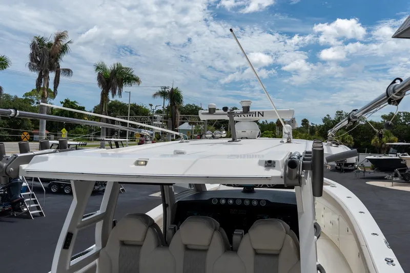 Slide: The Image of 2023 Solace 41CS boat with advanced navigation equipment under a clear blue sky. - 17