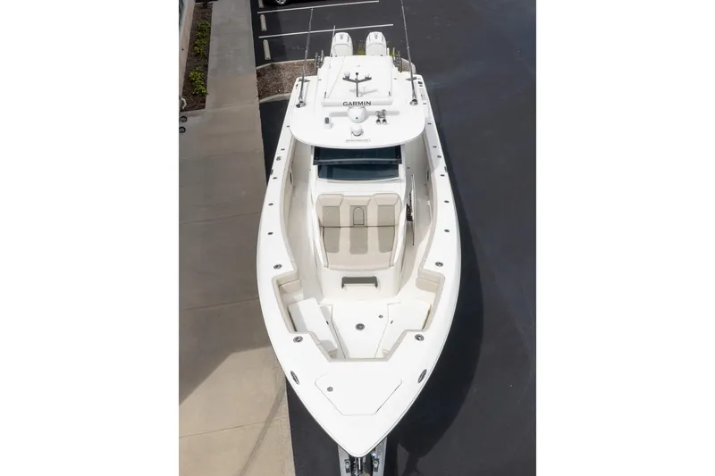 Slide: The Image of 2023 Solace 41CS boat, aerial view, docked in a parking area. - 5