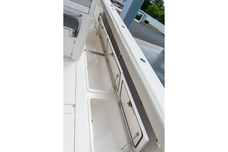 Slide: The Image of 2023 Solace 41CS boat storage compartments, open and spacious, showcasing sleek design. - 42