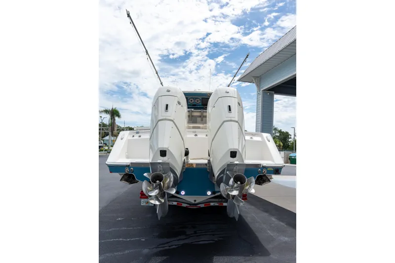 Slide: The Image of Rear view of 2023 Solace 41CS boat with dual outboard engines. - 18
