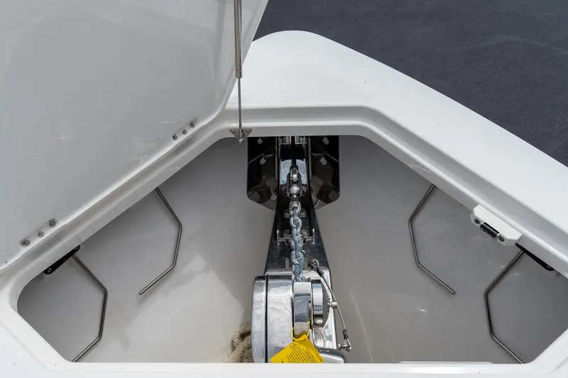Slide: The Image of Anchor compartment of 2023 Solace 41CS boat, showcasing chain and storage area. - 62