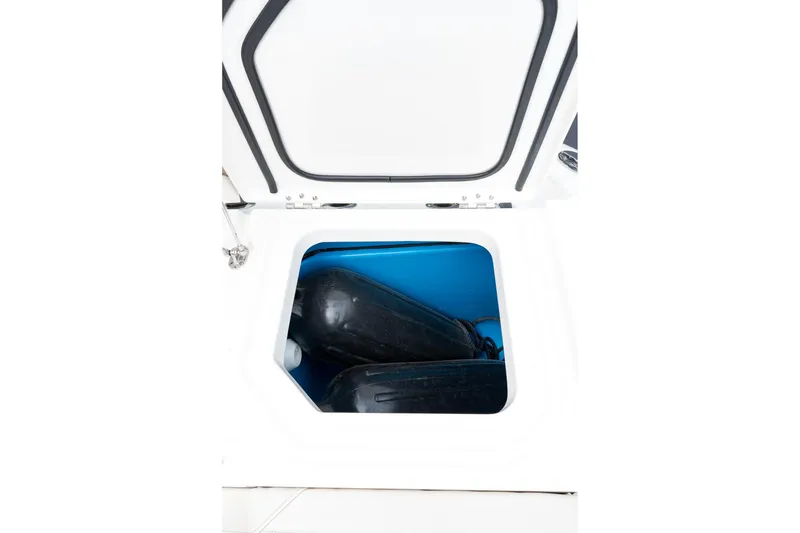 Slide: The Image of Open storage compartment on 2023 Solace 41CS boat, showing interior space. - 29