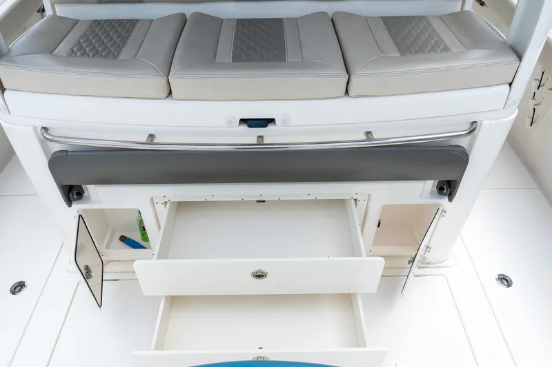 Slide: The Image of 2023 Solace 41CS boat interior with cushioned seating and open storage compartments. - 38