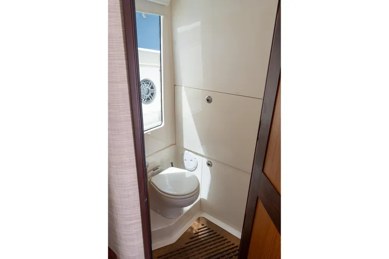 Slide: The Image of 2023 Solace 41CS yacht bathroom with modern fixtures and natural light. - 73