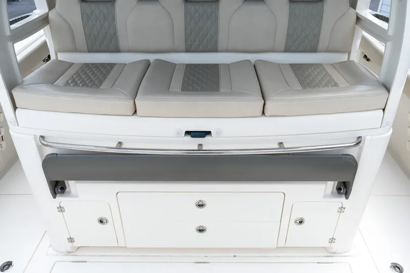 Slide: The Image of Luxurious seating on 2023 Solace 41CS boat with storage compartments. - 37