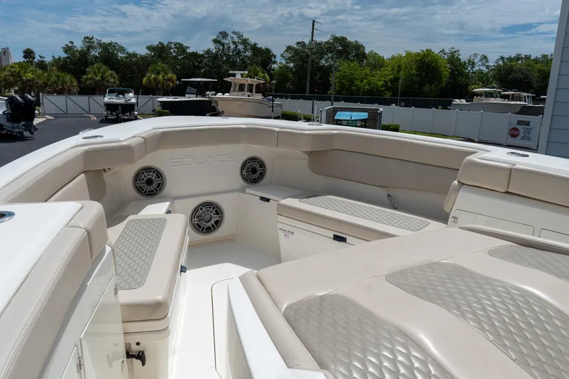 Slide: The Image of 2023 Solace 41CS boat interior with cushioned seating and built-in speakers. - 65