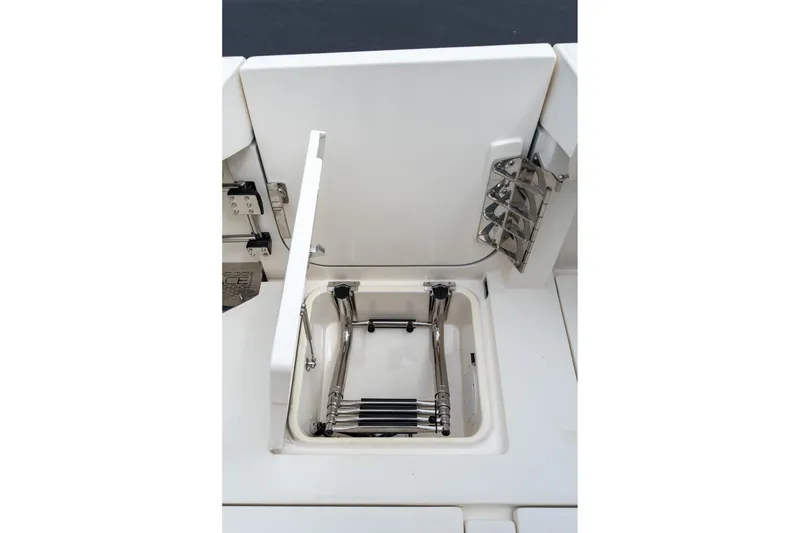 Slide: The Image of 2023 Solace 41CS boat ladder compartment with stainless steel fittings. - 33