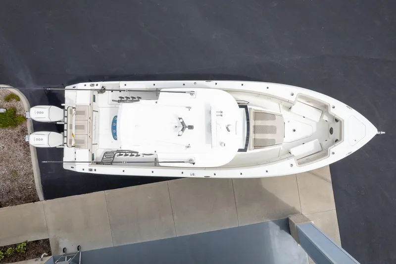Slide: The Image of Aerial view of 2023 Solace 41CS boat docked, showcasing sleek design and twin engines. - 6