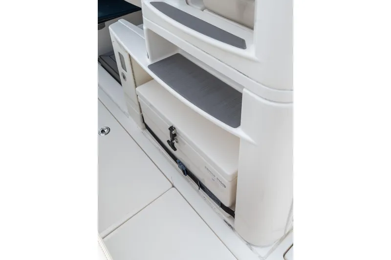 Slide: The Image of 2023 Solace 41CS boat interior storage compartment with shelves and cooler. - 45