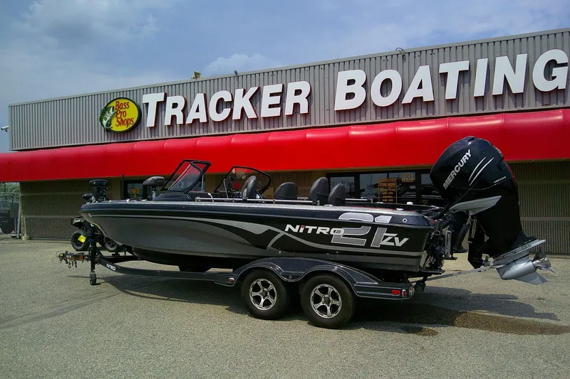 Slide: The Image of 2018 Nitro ZV21 boat outside Tracker Boating store with Mercury engine. - 2