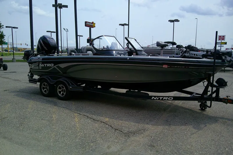 Slide: The Image of 2018 Nitro ZV21 fishing boat on trailer in parking lot. - 5