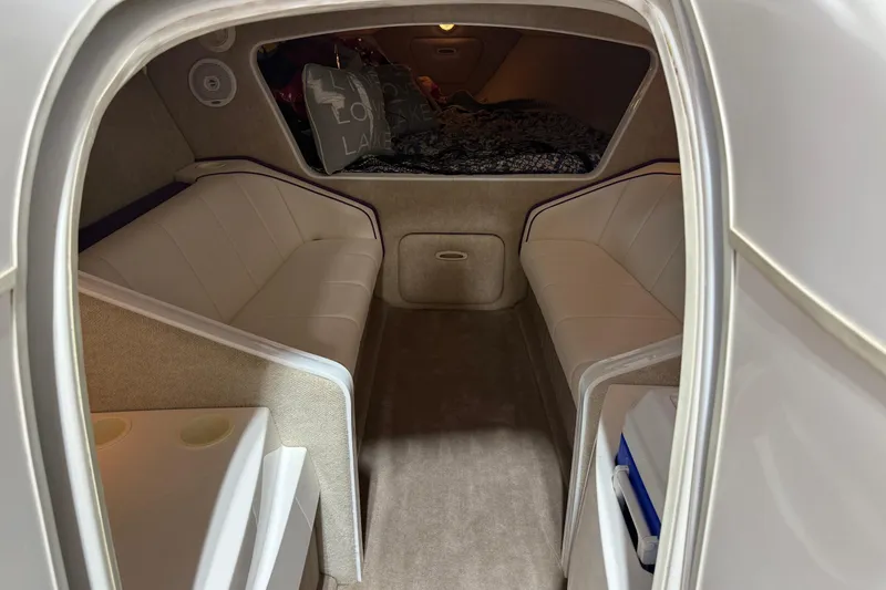 Slide: The Image of Interior cabin of a 2002 Nordic Boats 28' Heat, featuring plush seating and cozy decor. - 24
