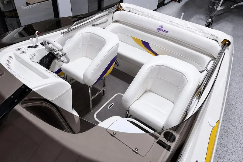 Slide: The Image of 2002 Nordic Boats 28' Heat interior with white seating and modern dashboard design. - 12