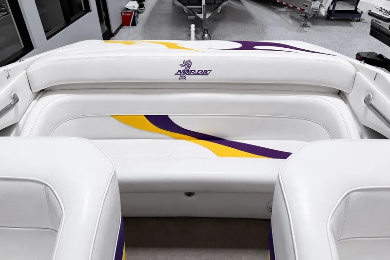 Slide: The Image of 2002 Nordic Boats 28' Heat interior with white, purple, and yellow upholstery design. - 14
