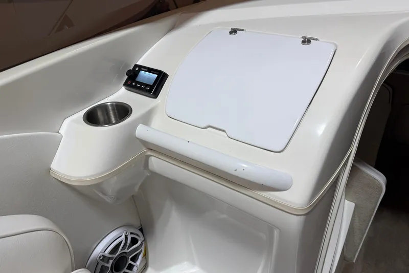 Slide: The Image of Interior of 2002 Nordic Boats 28' Heat featuring control panel and cup holder. - 22
