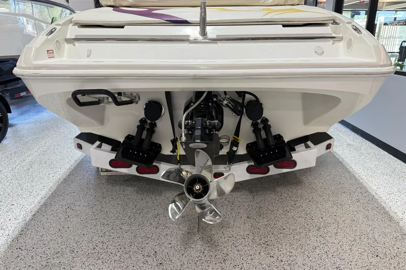 Slide: The Image of Rear view of a 2002 Nordic Boats 28' Heat, showcasing the propeller and engine components. - 5