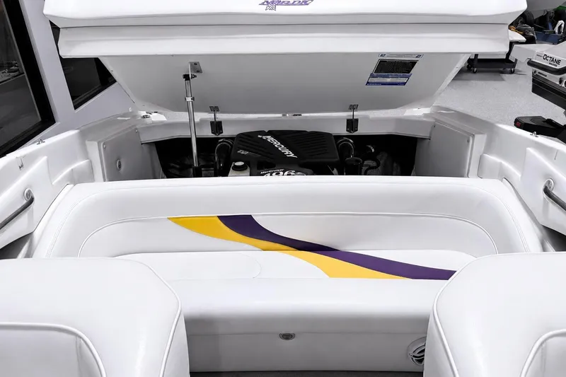 Slide: The Image of 2002 Nordic Boats 28' Heat engine compartment with white and purple seating. - 15