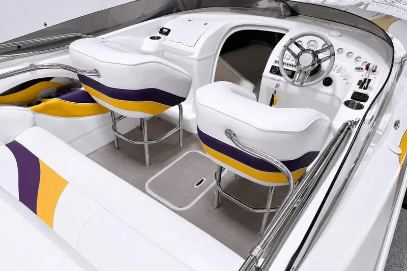 Slide: The Image of 2002 Nordic Boats 28' Heat interior with white, purple, and yellow seating, sleek dashboard design. - 21