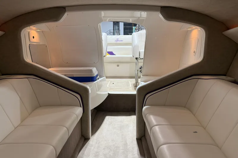Slide: The Image of Interior of a 2002 Nordic Boats 28' Heat, featuring plush seating and modern design. - 26