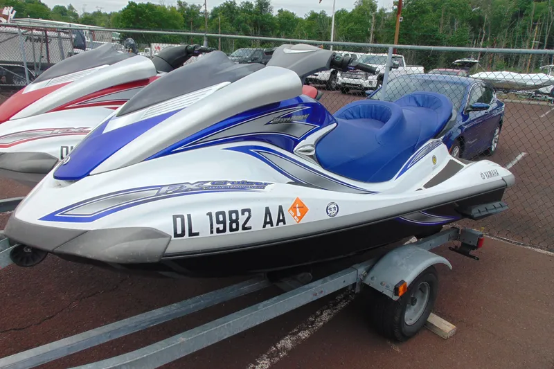 Slide: The Image of 2006 Yamaha WaveRunner FX Cruiser on trailer, blue and white design, parked outdoors. - 5