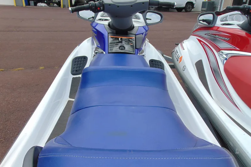 Slide: The Image of 2006 Yamaha WaveRunner FX Cruiser with blue seat, parked alongside another watercraft. - 1
