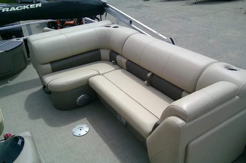 Slide: The Image of 2023 Sun Tracker Fishin' Barge 20 DLX, featuring comfortable beige seating. - 7