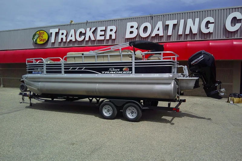 Slide: The Image of 2023 Sun Tracker Fishin' Barge 20 DLX pontoon boat at Tracker Boating Center. - 2