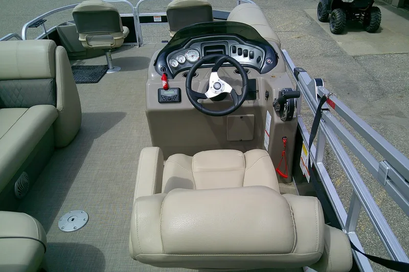 Slide: The Image of 2023 Sun Tracker Fishin' Barge 20 DLX interior with steering console and seating. - 8