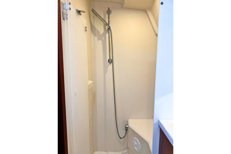 Slide: The Image of Compact shower area in 2020 Hanse 458 yacht, featuring sleek design and modern fixtures. - 26