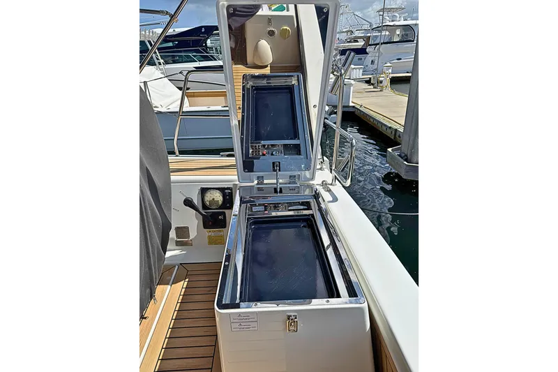 Slide: The Image of Open cockpit storage on 2020 Hanse 458 yacht, docked at marina. - 10