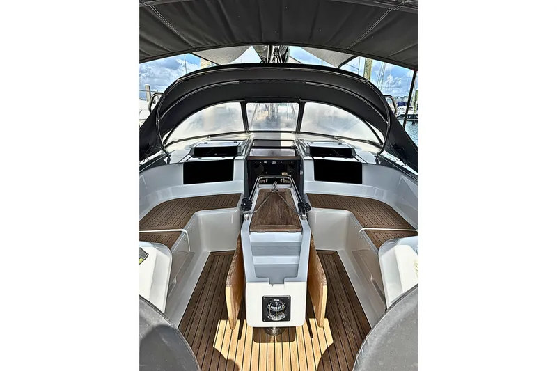 Slide: The Image of 2020 Hanse 458 yacht cockpit with sleek design and wooden flooring. - 12