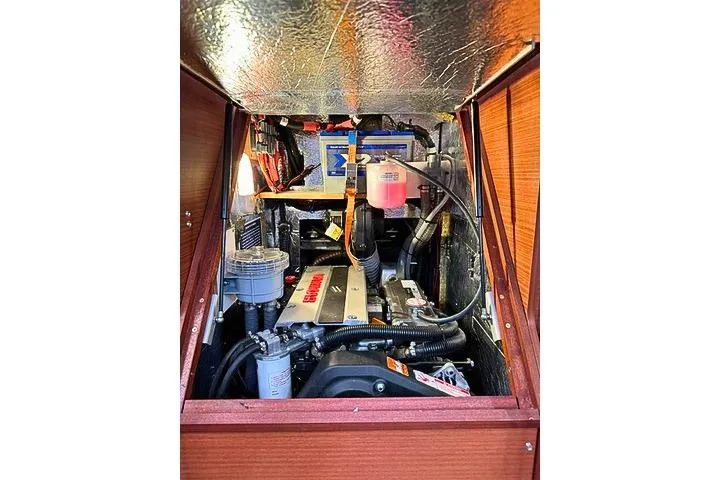 Slide: The Image of Engine compartment of a 2020 Hanse 458 yacht, showcasing mechanical components and wiring. - 28