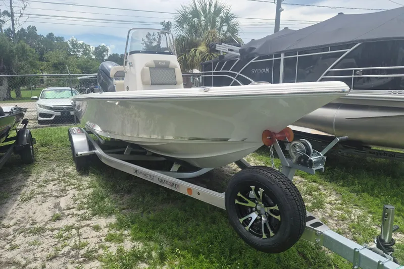 The Image of 2026 Key West 210 Bay Reef boat on trailer, parked outdoors. - 1