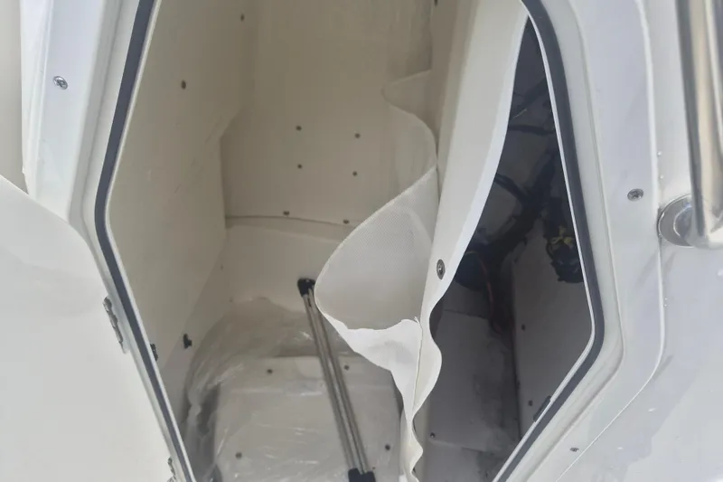 Slide: The Image of Interior view of a 2026 Key West 210 Bay Reef boat compartment. - 16
