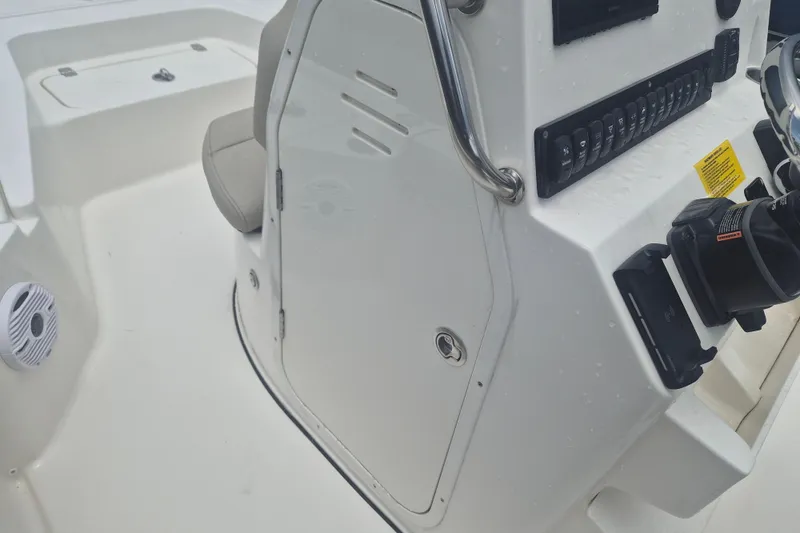Slide: The Image of 2026 Key West 210 Bay Reef boat console with controls and seating. - 15