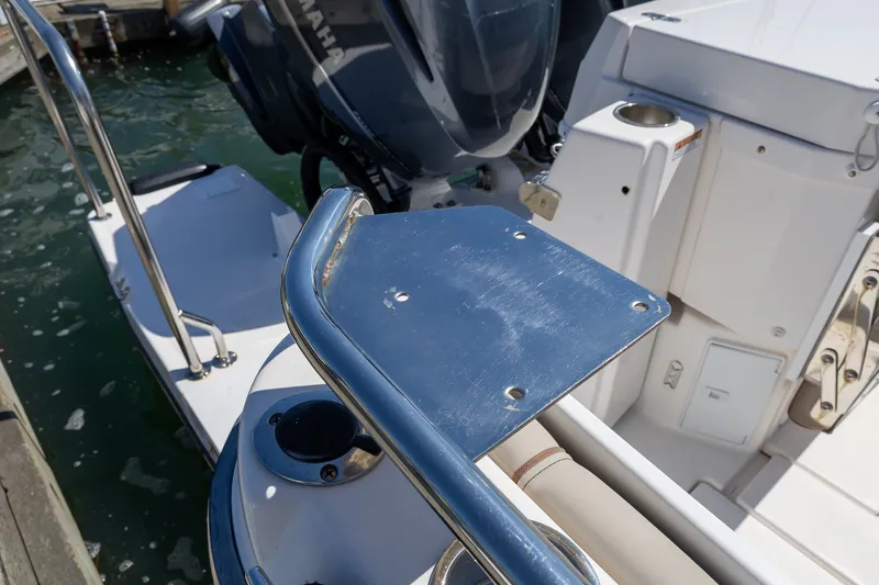 Slide: The Image of 2021 Cutwater C-32 Coupe boat stern with Yamaha engine and stainless steel railing. - 3