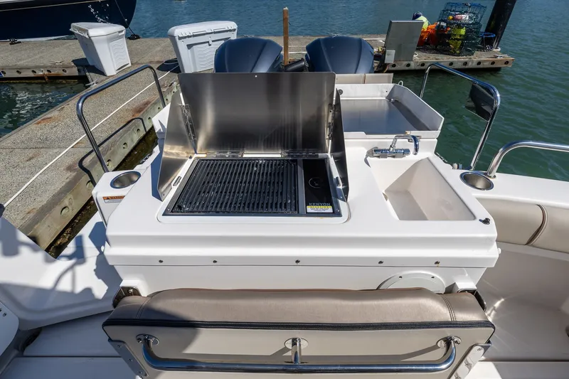 Slide: The Image of Outdoor kitchen on 2021 Cutwater C-32 Coupe boat with grill and sink. - 8