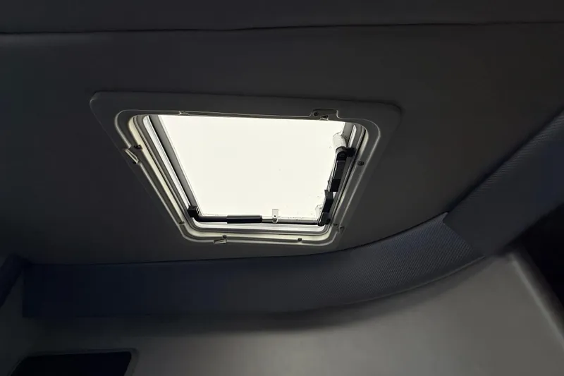 Slide: The Image of Interior view of a 1995 Formula 303 SR-1 boat hatch, showcasing sleek design. - 30